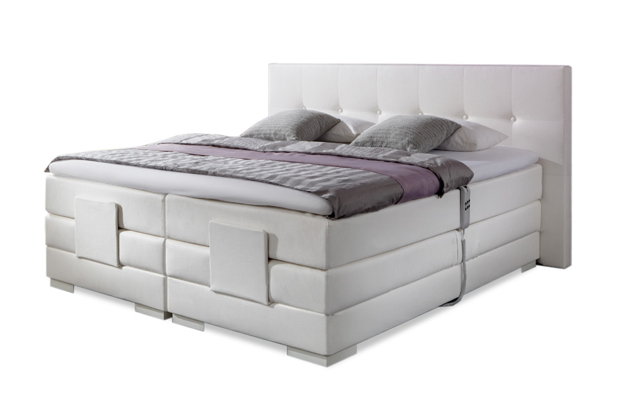 Hotelboxsprings Luxe hotelboxspring met hoog hoofdbord en opgemaakt bed in een moderne, lichte kamer