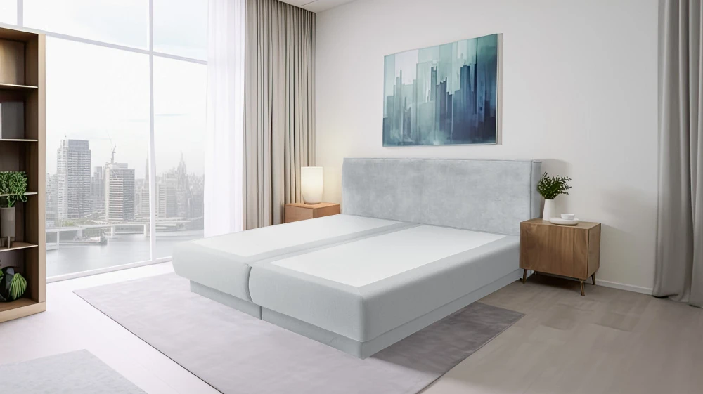 hotelboxsprings Moderne slaapkamer met groot tweepersoonsbed en panoramisch stadszicht.